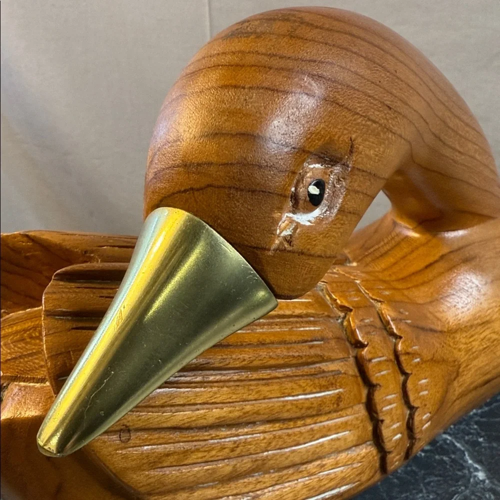 Handcrafted vintage Wooden goose decoy with brass beak